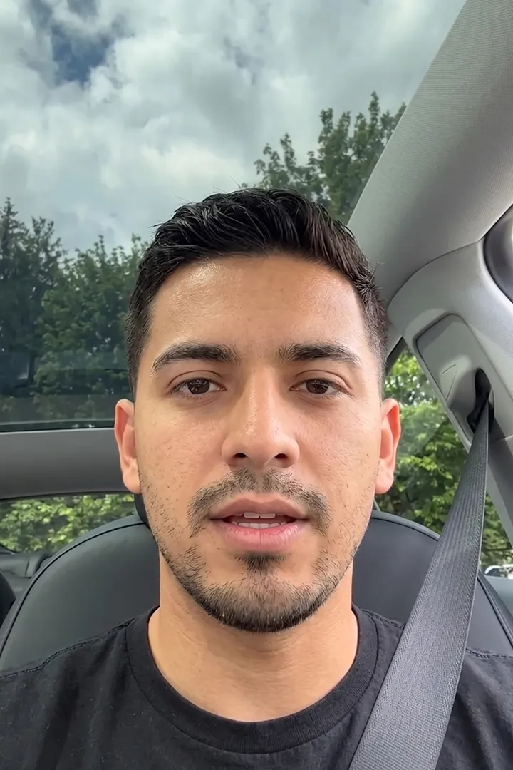 A customer recording a video response in his car